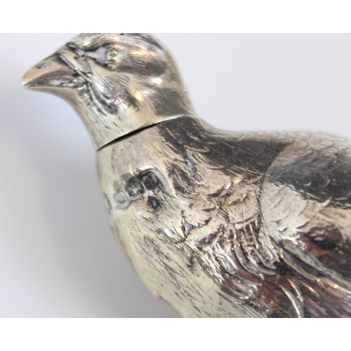 62 - A George V silver novelty pepperette, 'RHH' Sheffield 1925, the pepperette modelled as a game bird w... 