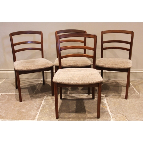 633 - A set of four 'E Gomme, G-Plan' teak dining chairs, circa 1980, each chair with a rail back over a p... 