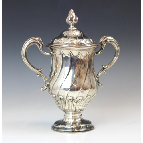 70 - A George II silver twin handled cover and cup, Lewis Herne and Francis Butty, London 1759, the wryth... 