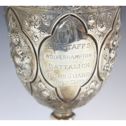 74 - A Victorian silver presentation cup, George Unite and Sons, Birmingham 1880, the profusely embossed ... 