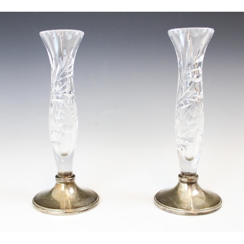 92 - A pair of silver and cut glass posy vases, Broadway & Co, Birmingham 1985, the baluster formed glass... 