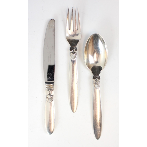 95 - A selection of silver and silver coloured items, to include a Georg Jensen 'Cactus' pattern christen... 