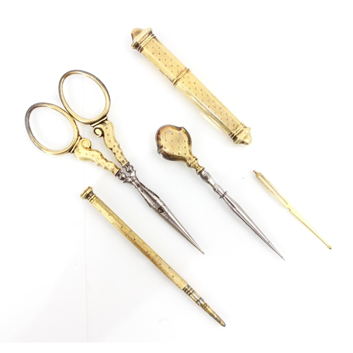 331 - A 19th century French yellow metal travelling sewing kit, comprising needle case, pencil, scissors, ... 