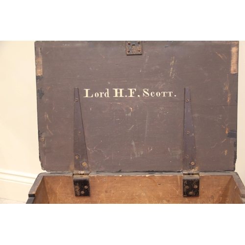 348 - A 19th century painted wooden trunk, applied with side iron swing handles, opening to a vacant inter... 