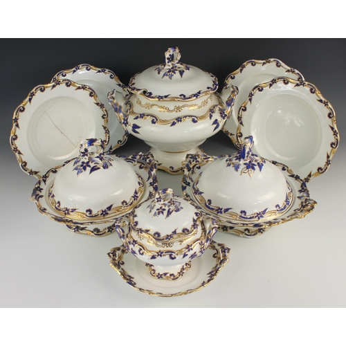 700 - A porcelain part dinner service, 19th century, each piece relief moulded with forget me nots against... 