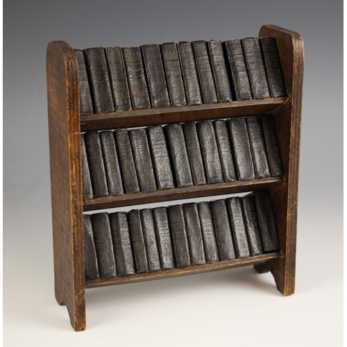 334 - Thirty eight black leather bound miniature volumes from The Works Of Shakespeare published by Allied... 