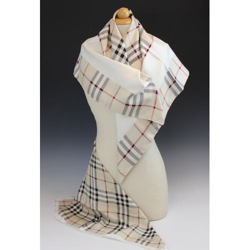 437 - A Burberry silk scarf, designed as traditional Burberry check with an internal cream border, with ro... 