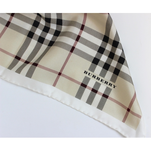 437 - A Burberry silk scarf, designed as traditional Burberry check with an internal cream border, with ro... 