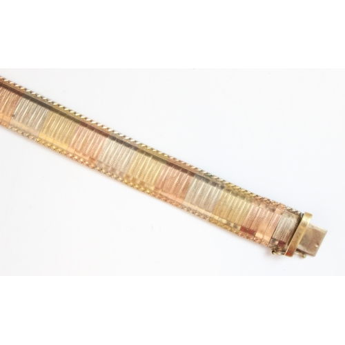 210 - A multi tone 9ct yellow gold bracelet, the bracelet designed as planished links with detailed border... 