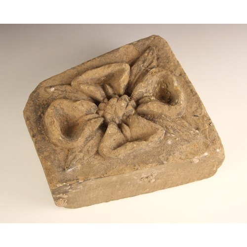 374 - Two medieval style carved stone corbels, the first relief carved with a flower head upon a rectangul... 