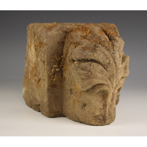 374 - Two medieval style carved stone corbels, the first relief carved with a flower head upon a rectangul... 