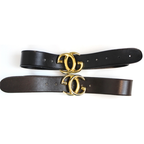 423 - A Gucci black leather belt, stamped 'Made in Italy by Gucci' with attached gilt metal double G logo ... 