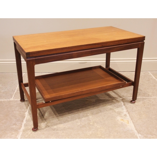 644 - A Remploy metamorphic teak coffee table, mid 20th century, the rectangular hinged top over a tray un... 