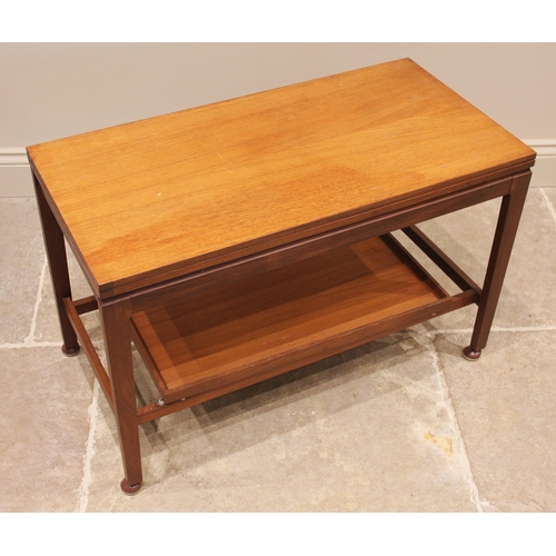 644 - A Remploy metamorphic teak coffee table, mid 20th century, the rectangular hinged top over a tray un... 