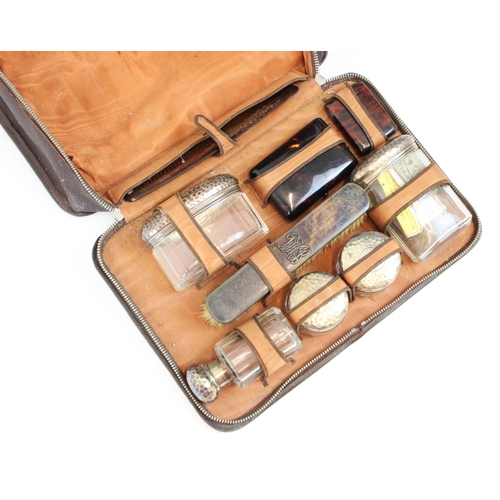 77 - A cased set of tortoiseshell and silver mounted dressing table items, including dressing table jars,... 