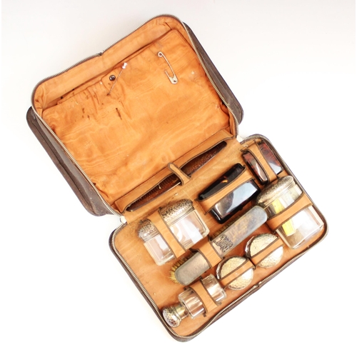 77 - A cased set of tortoiseshell and silver mounted dressing table items, including dressing table jars,... 