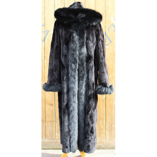 412 - A ladies hooded and reversible mink fur winter long coat, late 20th century, with black fox fur trim... 