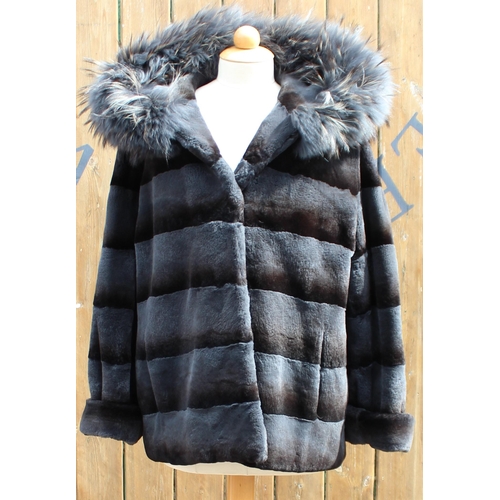 417 - A ladies hooded and reversible mink and Finn Racoon fur winter jacket, late 20th century, with Racoo... 