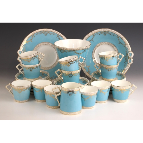 704 - A Staffordshire part tea service, early 20th century, each piece with geometric handle and tapering ... 