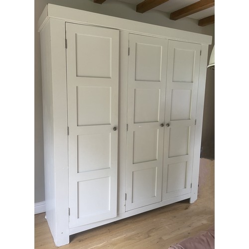 1120 - A large custom-made painted housekeepers/ hall cupboard, late 20th century, the three panelled doors... 