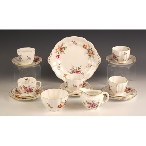 718 - A Royal Crown Derby part tea service in the Derby Roses pattern, 20th century, comprising: five teac... 