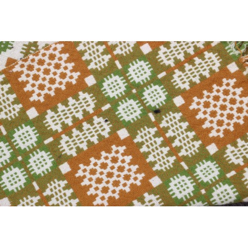 907 - A Welsh wool blanket, of traditional reversible geometric design in lime, russet, pink and cream, wi... 