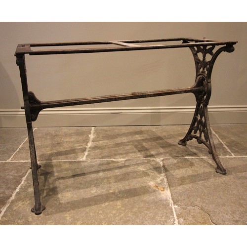 884 - A Victorian cast iron pub table, the twin trestle type supports cast with openwork foliate detail, u... 