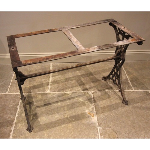 884 - A Victorian cast iron pub table, the twin trestle type supports cast with openwork foliate detail, u... 