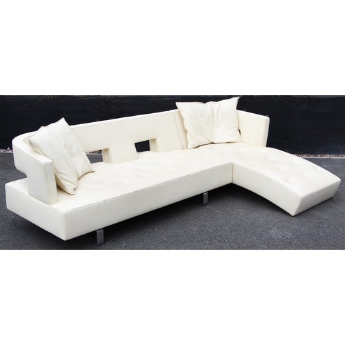 634 - A contemporary Italian cream leather corner sofa by Formenti, late 20th century, of 'L' shape with a... 