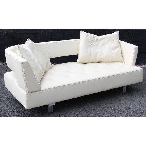 635 - A contemporary Italian cream leather sofa by Formenti, late 20th century, with a padded and arcaded ... 