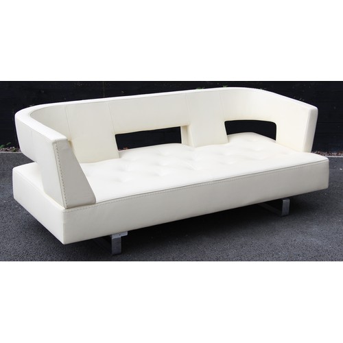 635 - A contemporary Italian cream leather sofa by Formenti, late 20th century, with a padded and arcaded ... 