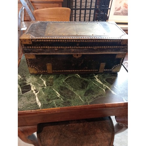 377 - An 18th century camphorwood leather bound and brass studded trunk, the hinged cover applied with a b... 