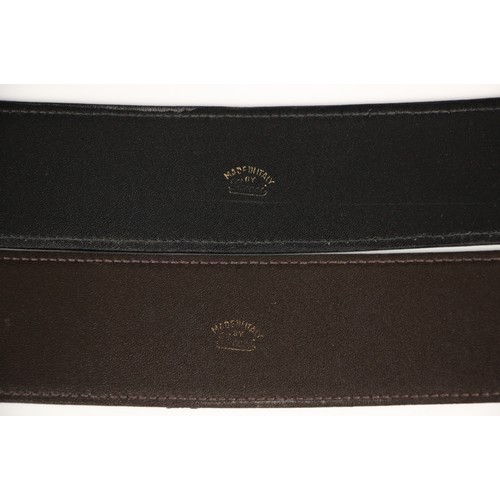 423 - A Gucci black leather belt, stamped 'Made in Italy by Gucci' with attached gilt metal double G logo ... 