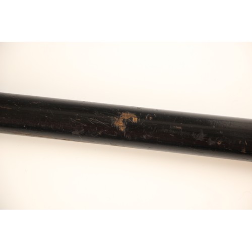 386 - A Burmese silver topped walking cane, 19th century, the tapered ebonised cane terminating with a hea... 