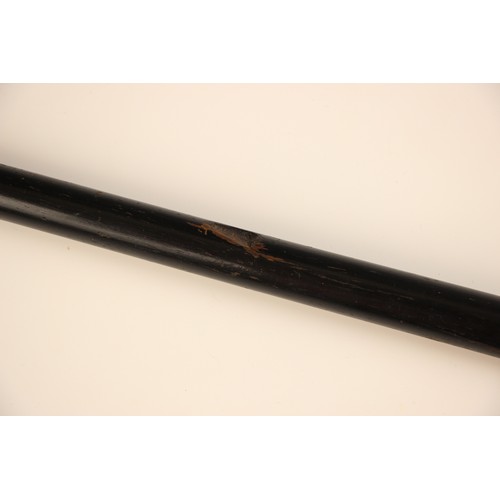 386 - A Burmese silver topped walking cane, 19th century, the tapered ebonised cane terminating with a hea... 