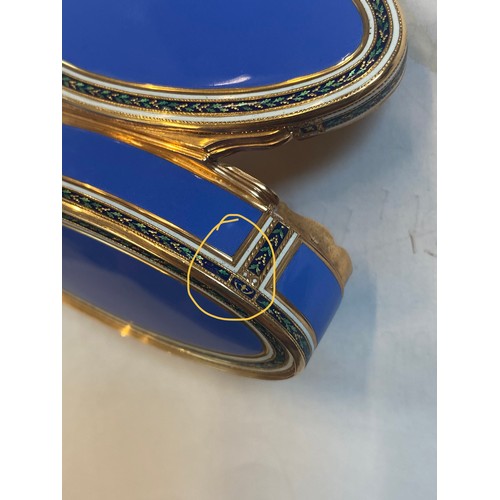 323 - A 20th century French yellow metal and enamel box, the oval hinged cover with blue enamel centre wit... 