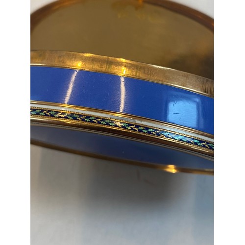 323 - A 20th century French yellow metal and enamel box, the oval hinged cover with blue enamel centre wit... 