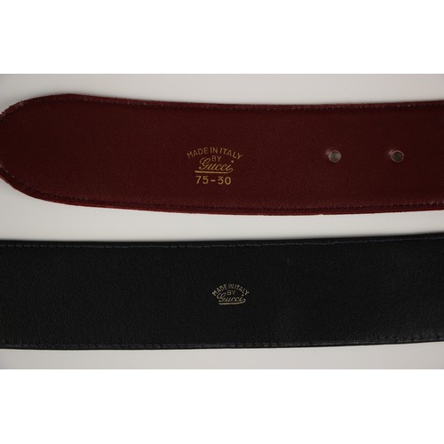 420 - A Gucci red suede leather belt, stamped 'Made in Italy by Gucci' with attached gilt metal double G l... 