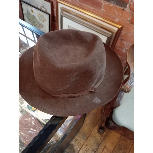 916 - A selection of five Herbert Johnson hats, 20th century, comprising: a soft felt brown hat, 14cm high... 