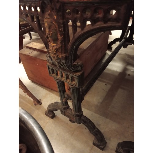 883 - A pair of Victorian painted cast iron pub tables, each raised upon twin trestle type supports, centr... 