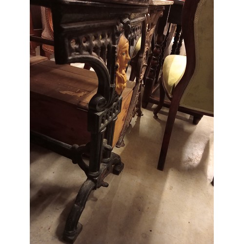 883 - A pair of Victorian painted cast iron pub tables, each raised upon twin trestle type supports, centr... 