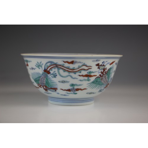 773 - A Chinese porcelain Doucai bowl, Kangxi period (1661-1722), the circular bowl externally decorated w... 