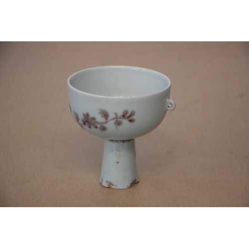 751 - A Chinese porcelain stem cup, possibly Ming Dynasty, the iron-red decorated bowl painted to the exte... 