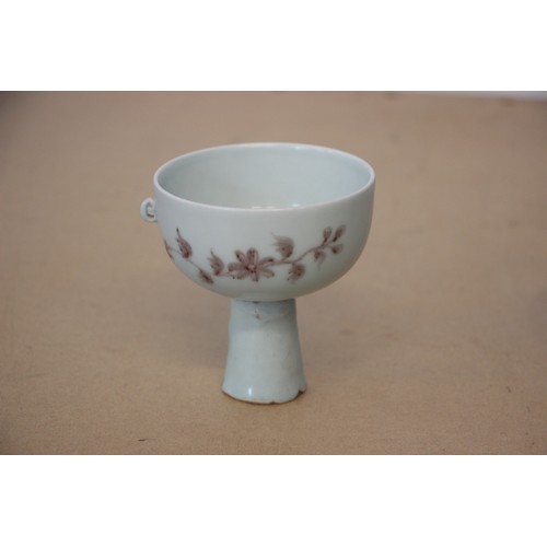 751 - A Chinese porcelain stem cup, possibly Ming Dynasty, the iron-red decorated bowl painted to the exte... 