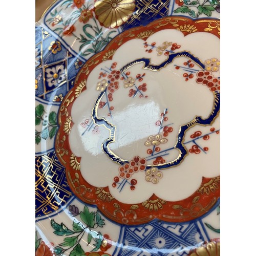 710 - Three Derby plates, late 18th/early 19th century, each decorated in the imari pattern, gilt scallope... 