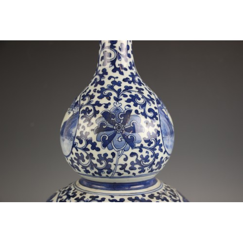 788 - A large Chinese porcelain blue and white double gourd vase, 19th century, the lower body decorated w... 