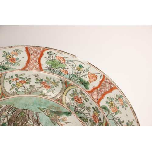 787 - A Chinese porcelain famille verte shallow bowl, Kangxi (1662-1722), the circular bowl centrally deco... 