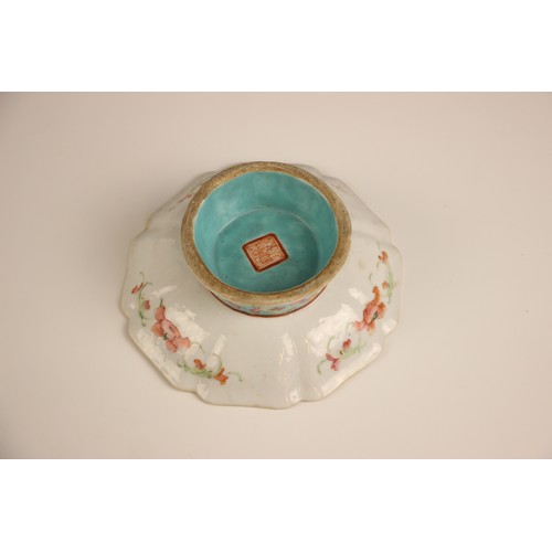 766 - A Chinese porcelain square stem-bowl, Tongzhi (1862-1874), decorated in the famille rose palette dep... 