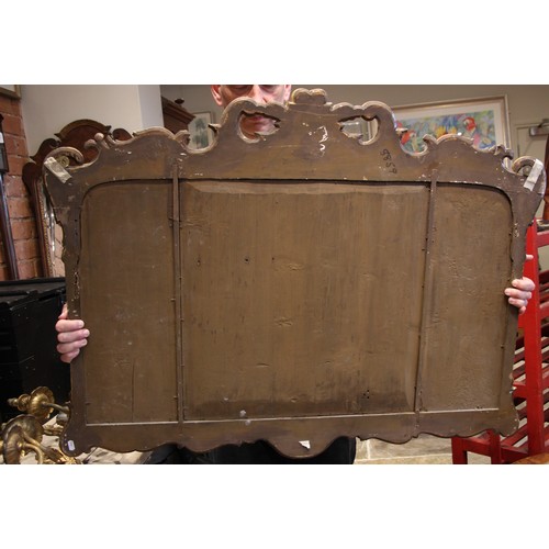 961 - A George II style giltwood and gesso overmantel triple plate wall mirror, the Prince of Wales feathe... 