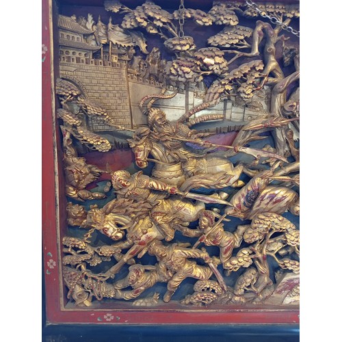 759 - A Chinese chaozhou giltwood and red lacquered carved panel, 19th century, the rectangular panel carv... 